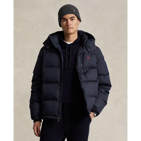 This image shows a person wearing a navy puffer jacket from Ralph Lauren for men