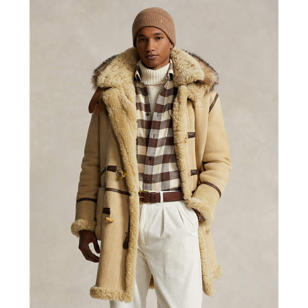 Duffle-coat bordé de cuir en peau lainée